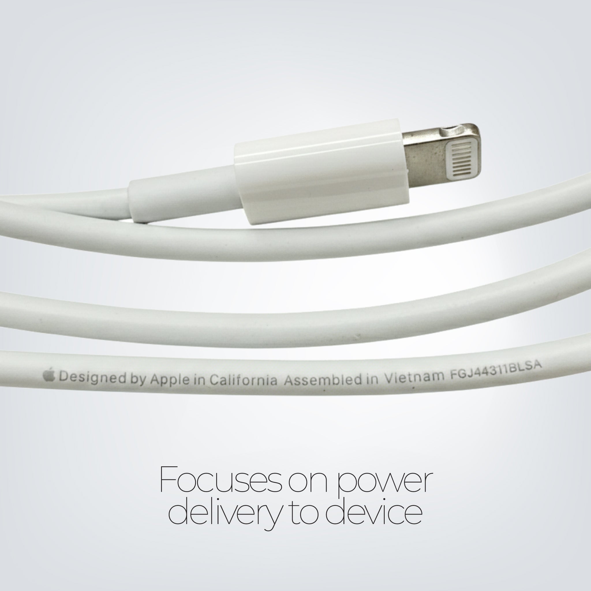 White Apple cable with connectors on a light gray background