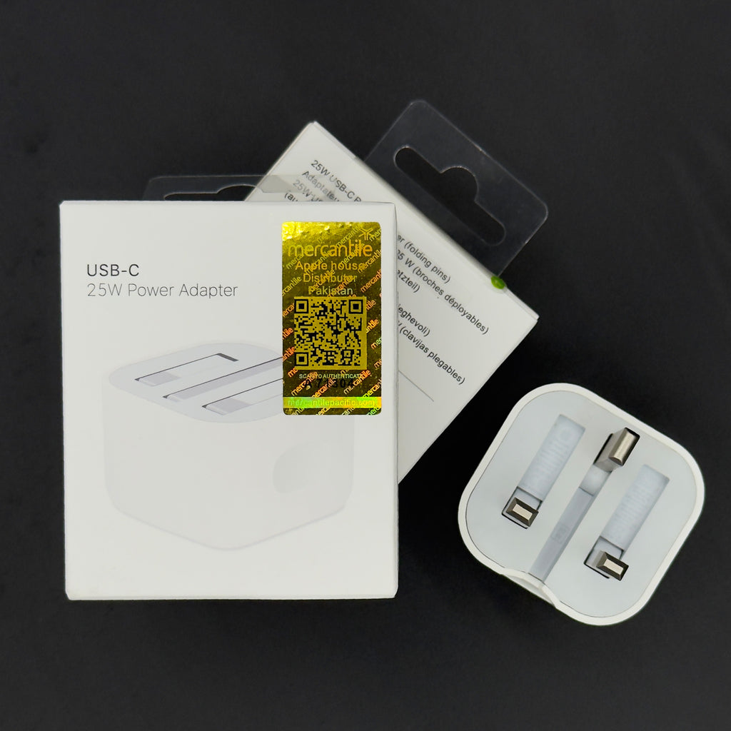 USB-C power adapter with packaging and branding on a dark background