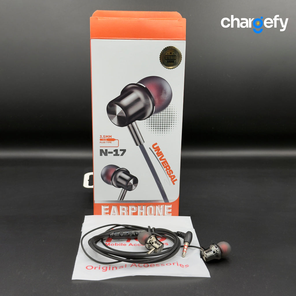 Earphone with packaging and accessories on a dark background